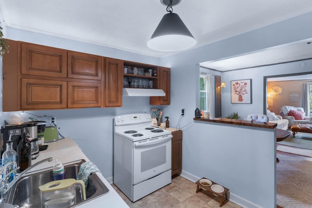 kitchen with sink, decorative light fixtures, a healthy amount of sunlight, and electric range