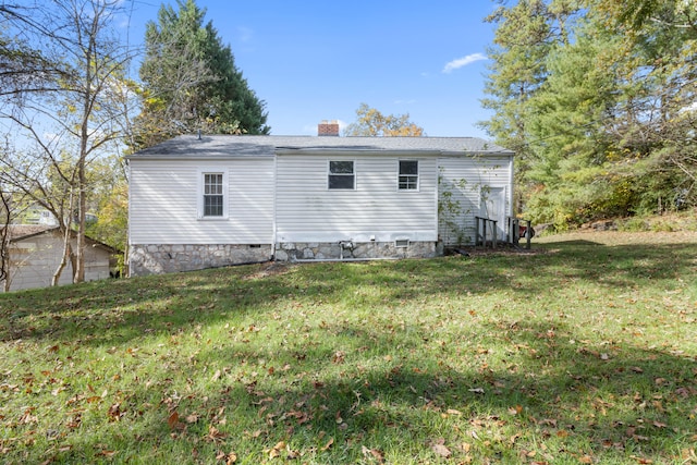 back of house with a yard