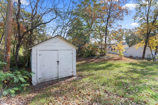 view of outbuilding featuring a yard