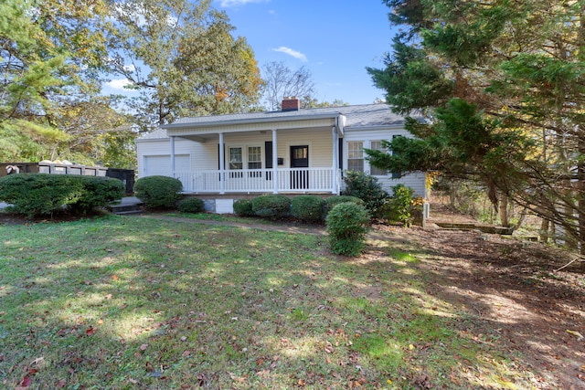 view of front of house with a porch and a front yard