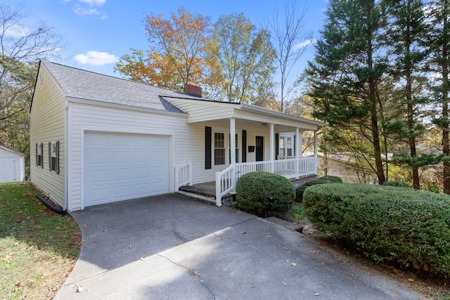 view of front of home featuring a porch and a garage