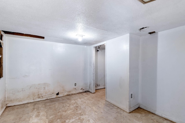 spare room featuring a textured ceiling