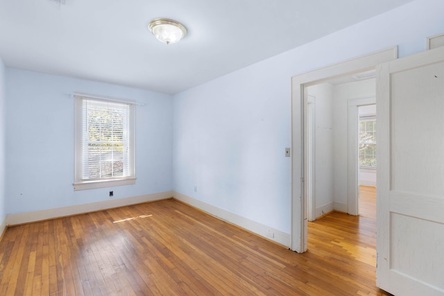 empty room featuring hardwood / wood-style flooring