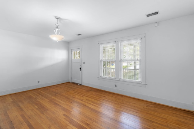 empty room featuring hardwood / wood-style flooring