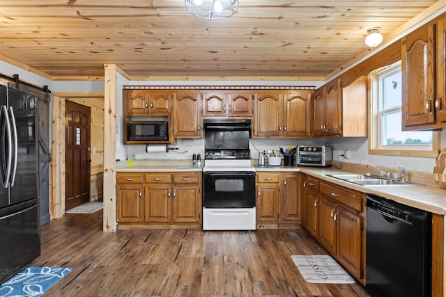 kitchen featuring dark hardwood / wood-style flooring, black appliances, a barn door, and wood ceiling