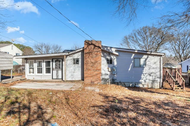 rear view of property featuring a patio