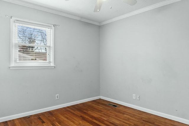 spare room featuring wood-type flooring and ornamental molding