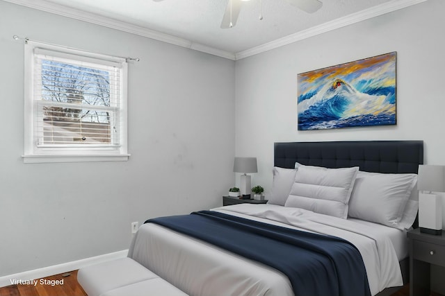 bedroom with hardwood / wood-style floors, ceiling fan, and crown molding