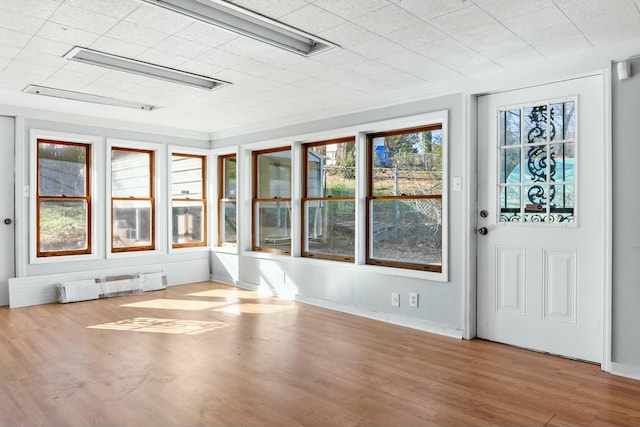 unfurnished sunroom with radiator