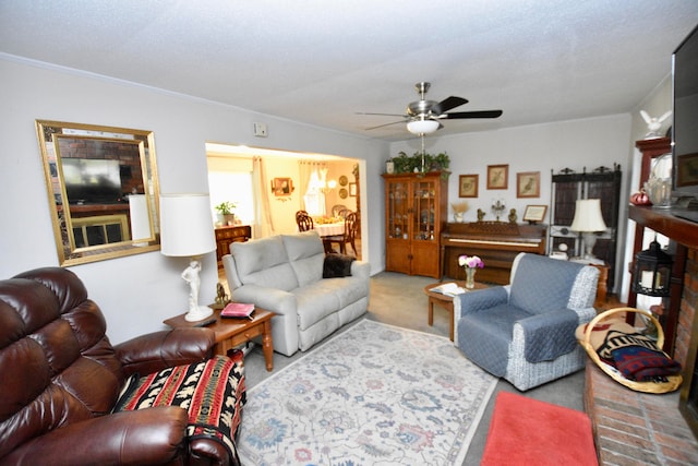 carpeted living room with ceiling fan