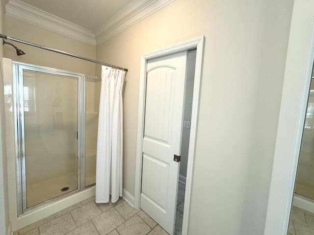 bathroom featuring ornamental molding and a shower with shower curtain