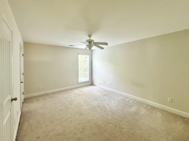 spare room with light carpet