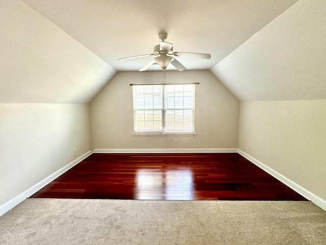 additional living space featuring hardwood / wood-style floors, ceiling fan, and vaulted ceiling