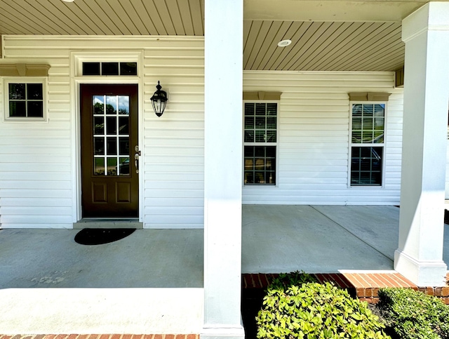 doorway to property featuring covered porch