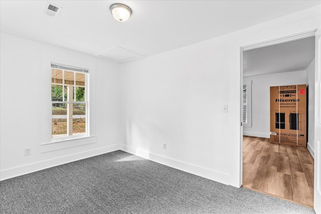 spare room with hardwood / wood-style flooring