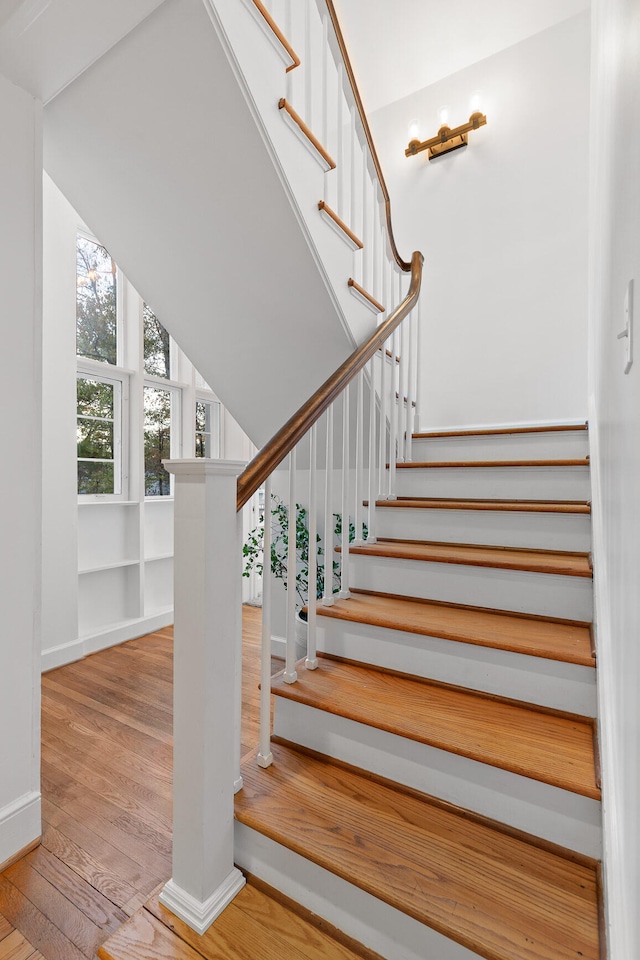 staircase featuring hardwood / wood-style flooring