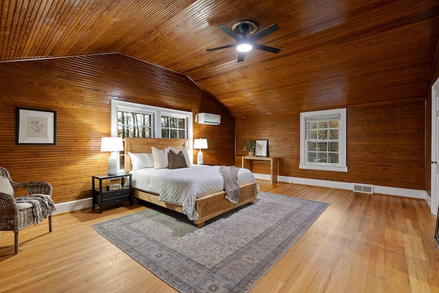 bedroom featuring wood-type flooring, a wall mounted air conditioner, lofted ceiling, wooden ceiling, and ceiling fan