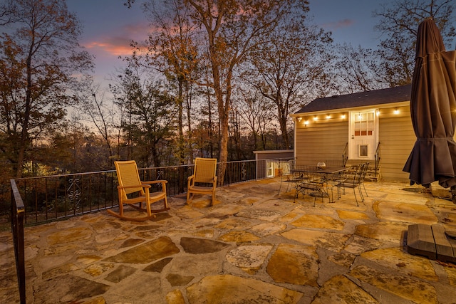 view of patio terrace at dusk