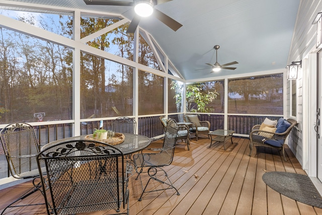 sunroom / solarium with lofted ceiling and ceiling fan