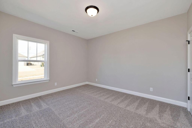 unfurnished room featuring carpet floors