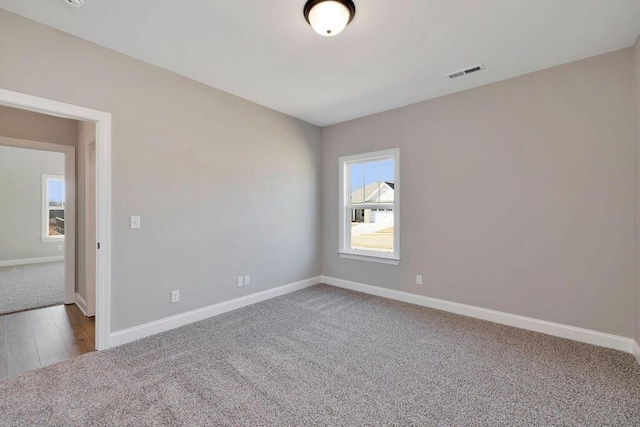 spare room featuring carpet floors