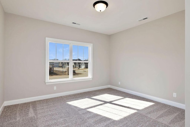 empty room featuring carpet flooring