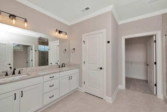 bathroom featuring ornamental molding, vanity, and walk in shower