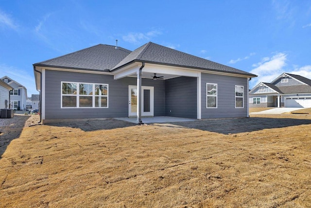 rear view of house with a lawn, ceiling fan, and a patio area