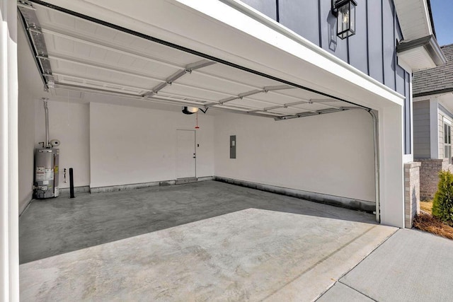 garage with a garage door opener, electric panel, and water heater