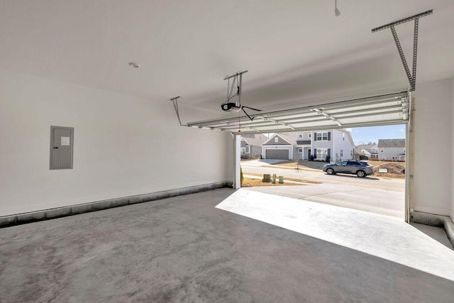 garage featuring a garage door opener and electric panel