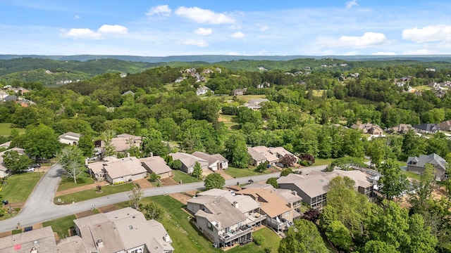 birds eye view of property featuring a residential view and a forest view