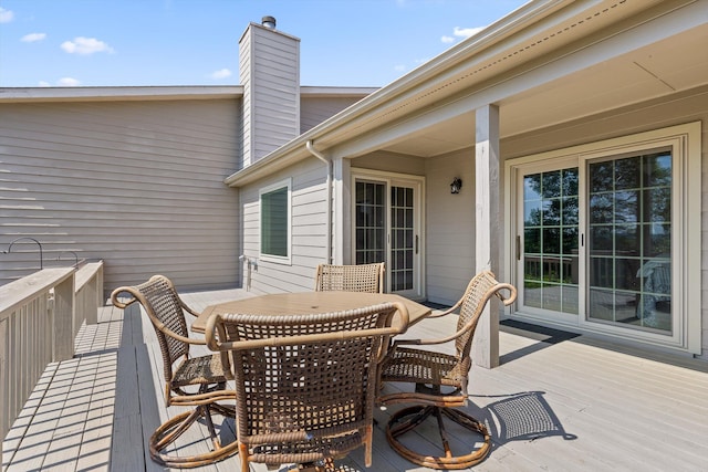 deck with outdoor dining area