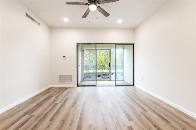 spare room featuring ceiling fan and light wood-type flooring