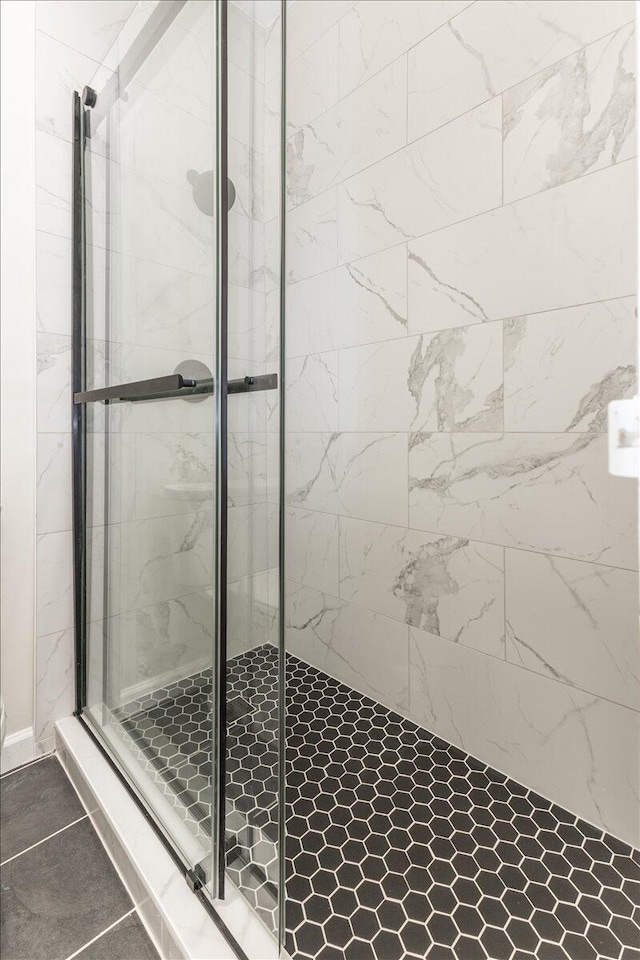 bathroom with a shower with shower door