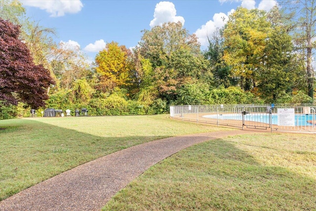 view of yard featuring a community pool