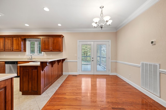 kitchen featuring dishwasher, french doors, a wealth of natural light, and pendant lighting