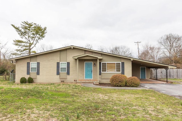 ranch-style house with a front lawn and a carport