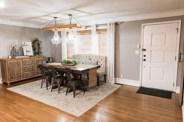 dining area with crown molding and dark hardwood / wood-style floors