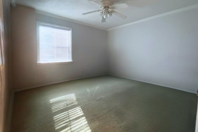 unfurnished room with baseboards, a ceiling fan, ornamental molding, a textured ceiling, and carpet flooring