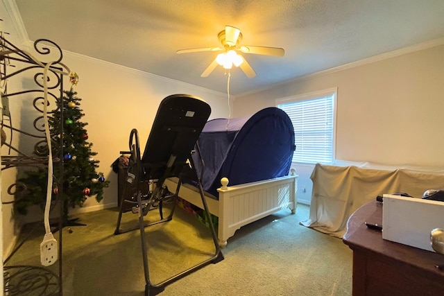 carpeted bedroom featuring ornamental molding, ceiling fan, a textured ceiling, and baseboards