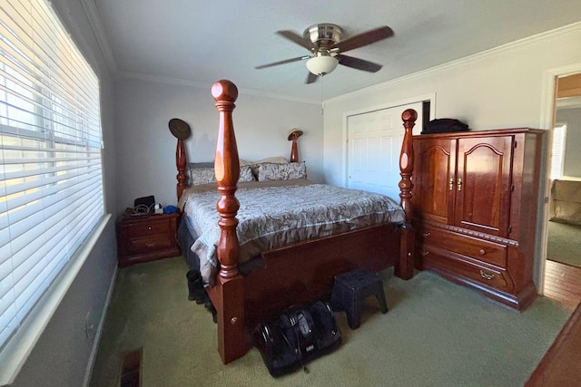 bedroom featuring ceiling fan, carpet flooring, and crown molding