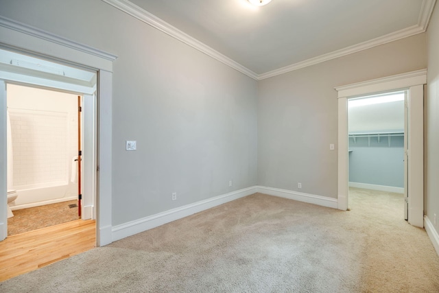 carpeted empty room with crown molding