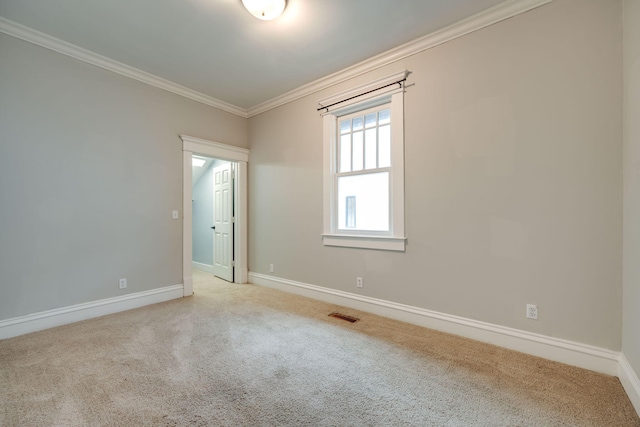 carpeted spare room with ornamental molding