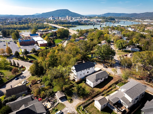 drone / aerial view featuring a water and mountain view