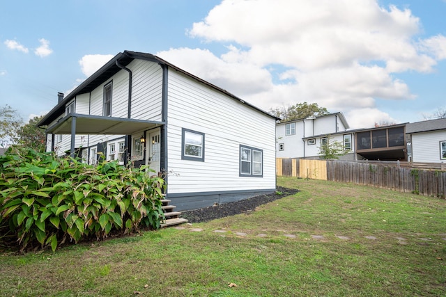 view of home's exterior featuring a yard