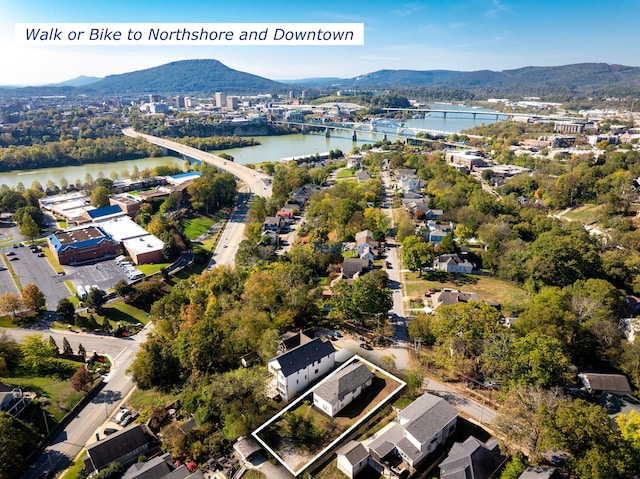 aerial view featuring a water and mountain view