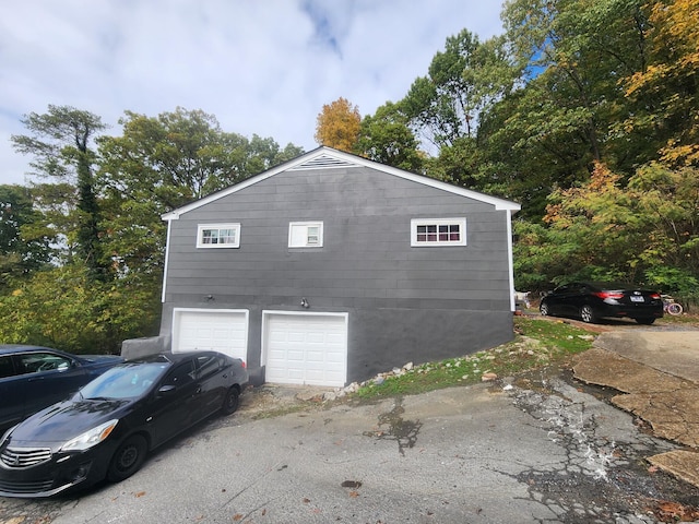 view of property exterior featuring a garage