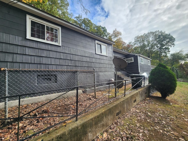 view of side of property with fence