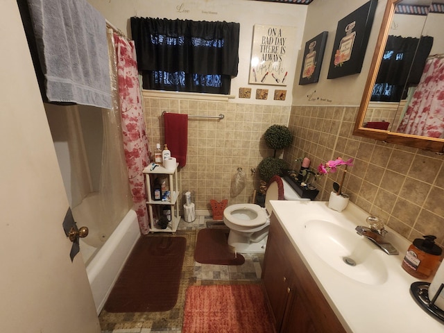 full bath with toilet, shower / bathtub combination with curtain, tile walls, and vanity