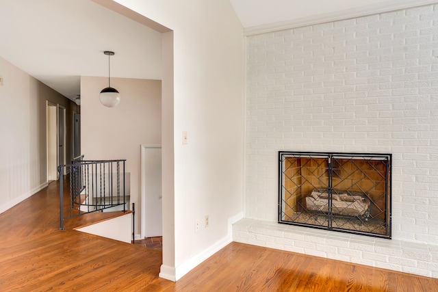 details with hardwood / wood-style floors and a fireplace